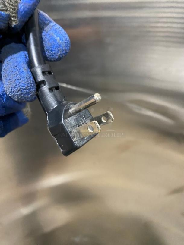 Alt text: Close-up of plug for Everest ESF1 commercial freezer, 115V, 1 phase.