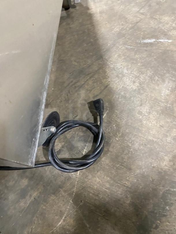 Alt text: True T-23F stainless steel freezer on casters, with visible power cord. Energy Star certified, model T-23F.