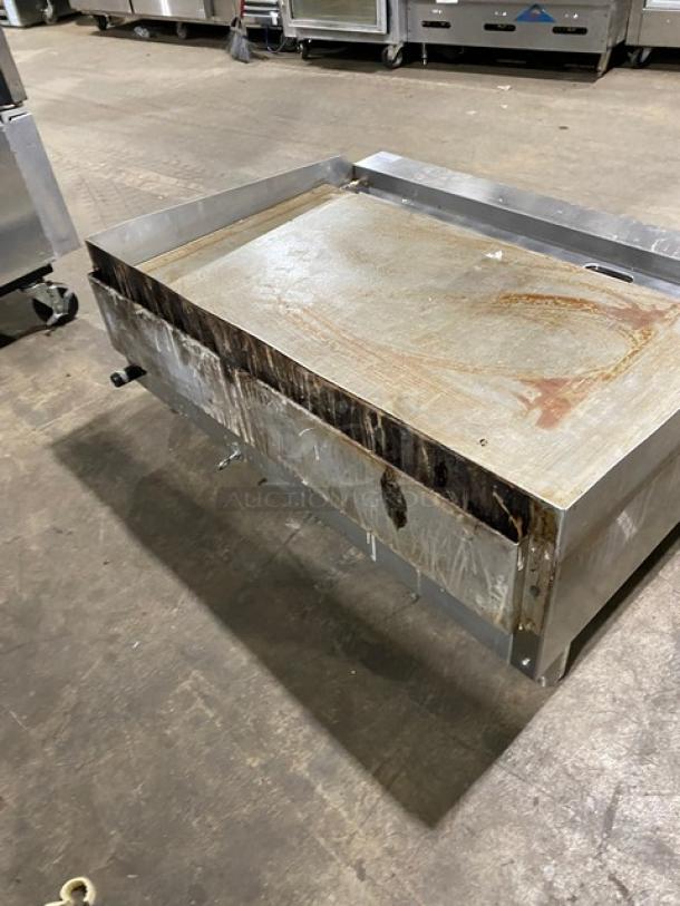 Cook Rite stainless steel natural gas flat griddle with back and side splash, on legs; used condition.