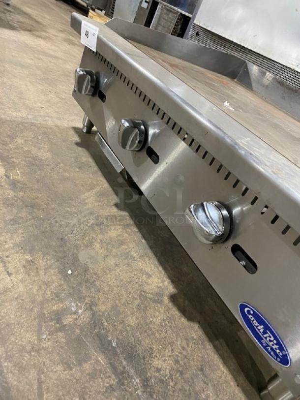 Cook Rite commercial stainless steel gas griddle, countertop design, with back and side splash, on legs, used condition.