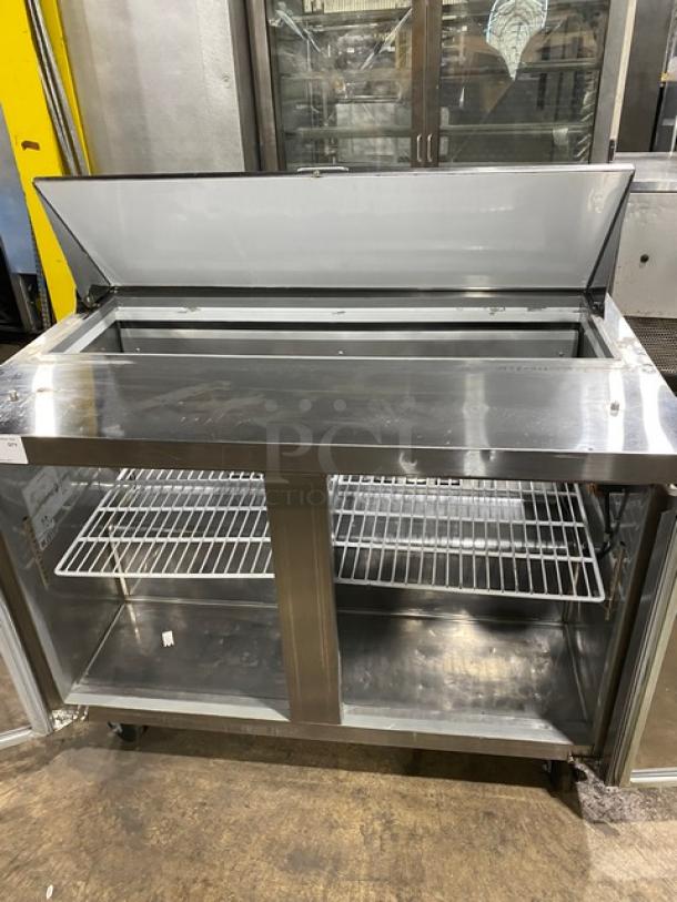 Commercial stainless steel 2-door refrigerated bain marie prep table, Model SCL2E, with poly-coated wire rack, on casters.