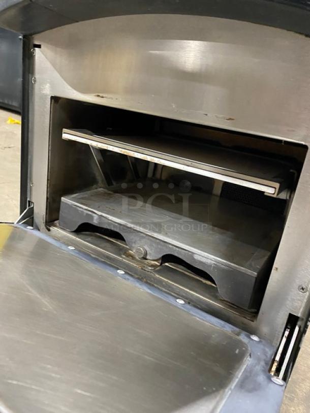 TurboChef NGO ventless rapid cook oven, 2022 model, black, countertop, chipotle style, electric, with crank bar, on legs.