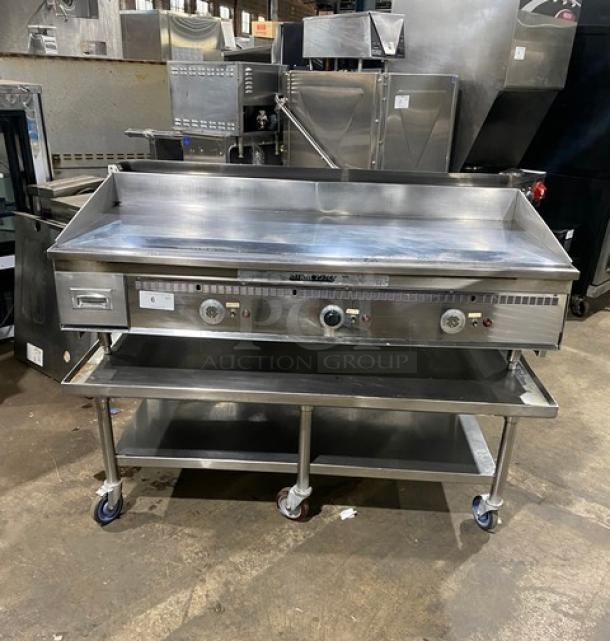 Keating Miraclean Series stainless steel griddle with thermostatic controls, back and side splash, undershelf stand, model 60X30, on casters.