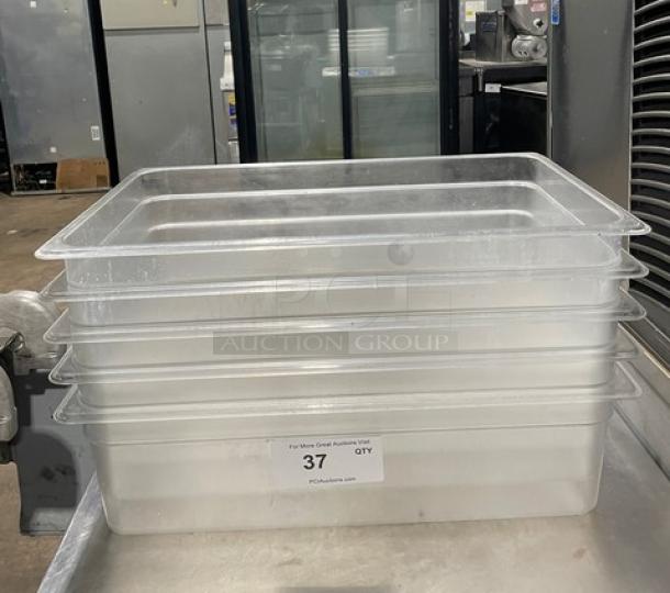 Lot of commercial clear polycarbonate food pans, used condition, stackable design, auction tag indicates quantity: 37.