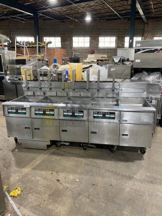 Pitco Frialator SG18JS 4-bay deep fat fryer system, stainless steel, natural gas, with digital controls, filter pan, and casters.