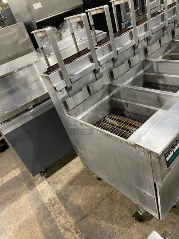 Pitco Frialator SG18-JS 4-bay fryer system, stainless steel, natural gas, digital controls, right-side dump station, on casters.
