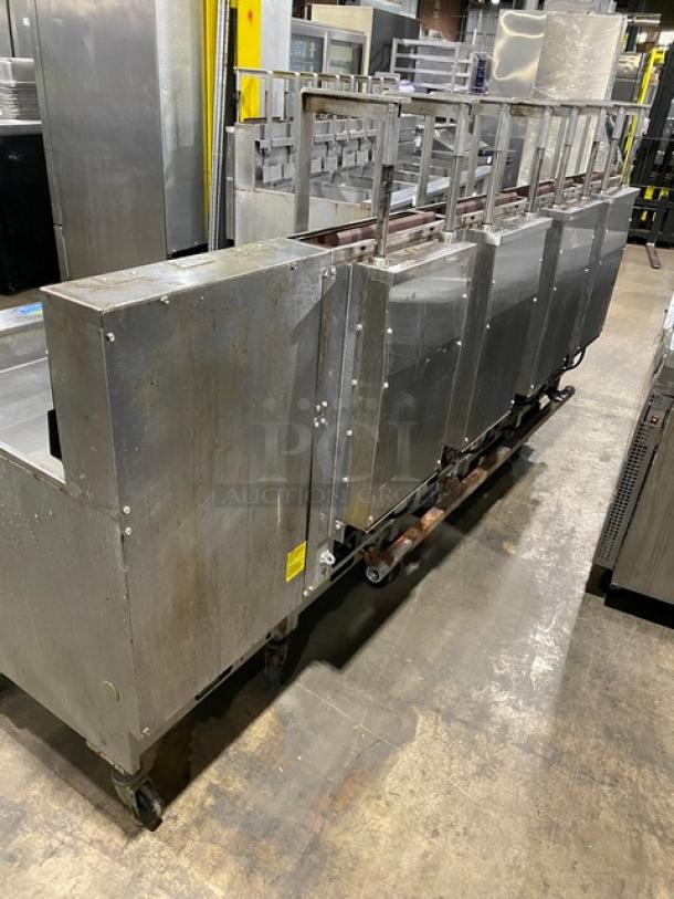 Pitco Frialator SG18JS 4-bay stainless steel deep fat fryer, natural gas, with filter pan, digital controls, and casters.