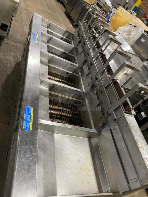 Pitco SG18JS 4-bay stainless steel fryer, natural gas, digital controls, right dump station, filter pan, on casters.