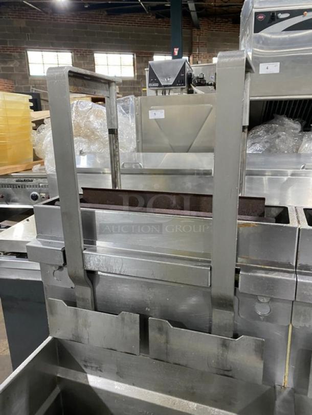 Pitco Frialator SG18JS 4-bay stainless steel fryer system with right-side dump, filter pan, backsplash, basket hangers, digital controls.