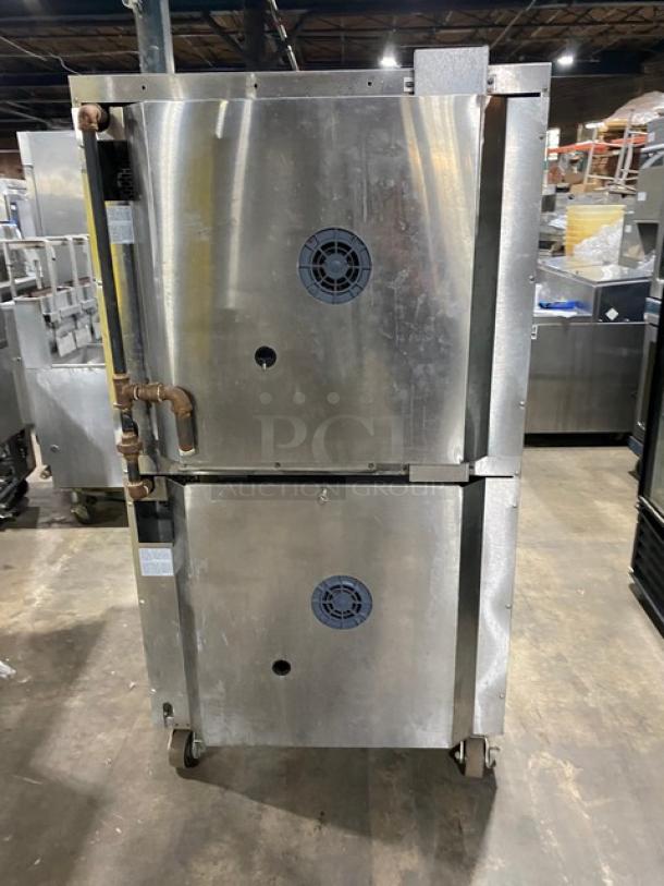 Garland Master Series stainless steel double convection oven, natural gas, thermostatic controls, wired racks, on casters.