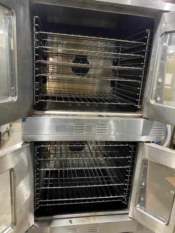 Garland Master Series stainless steel double-stacked convection oven, natural gas, thermostatic controls, wired racks, on casters.