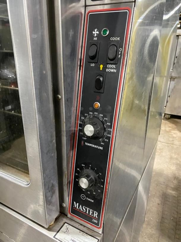 Garland Master Series stainless steel double convection oven, natural gas, thermostatic controls, wired racks, on casters.