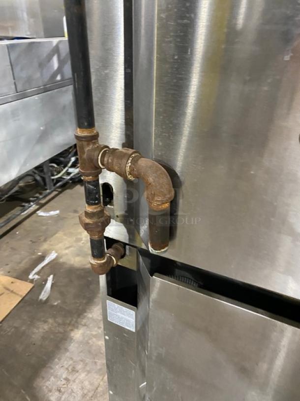 Garland Master Series double-stacked stainless steel convection oven with gas connection, on casters, thermostatic controls, and wired racks.