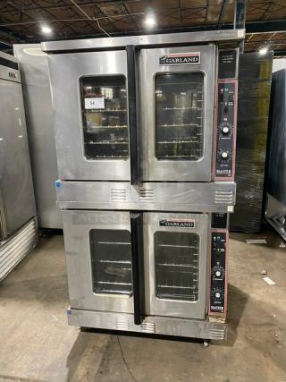 Garland Master Series stainless steel double-stacked convection oven, natural gas, with thermostatic controls, wired racks, on casters.