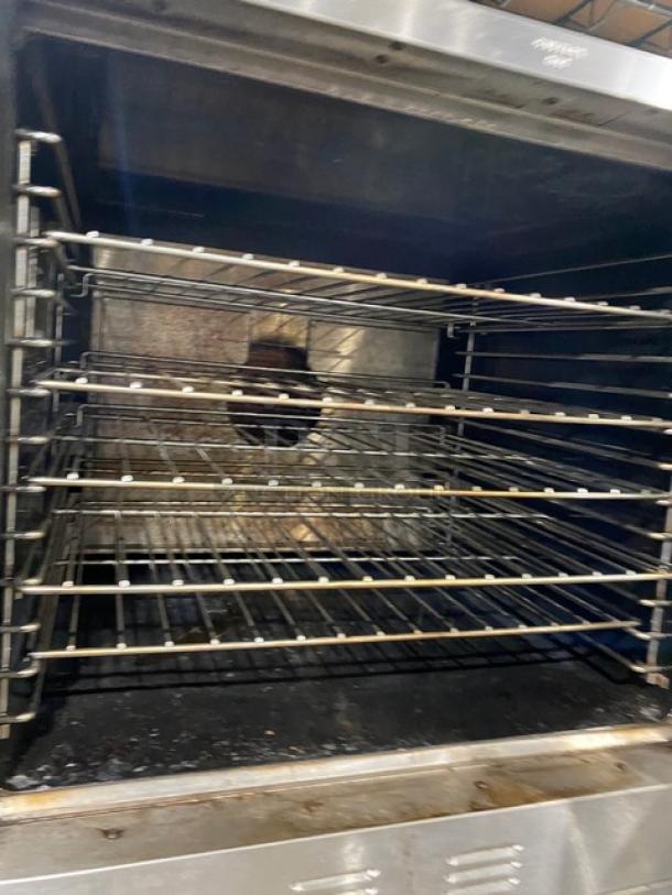 Garland Master Series stainless steel double stacked convection oven, natural gas, thermostatic controls, oven racks, on casters.