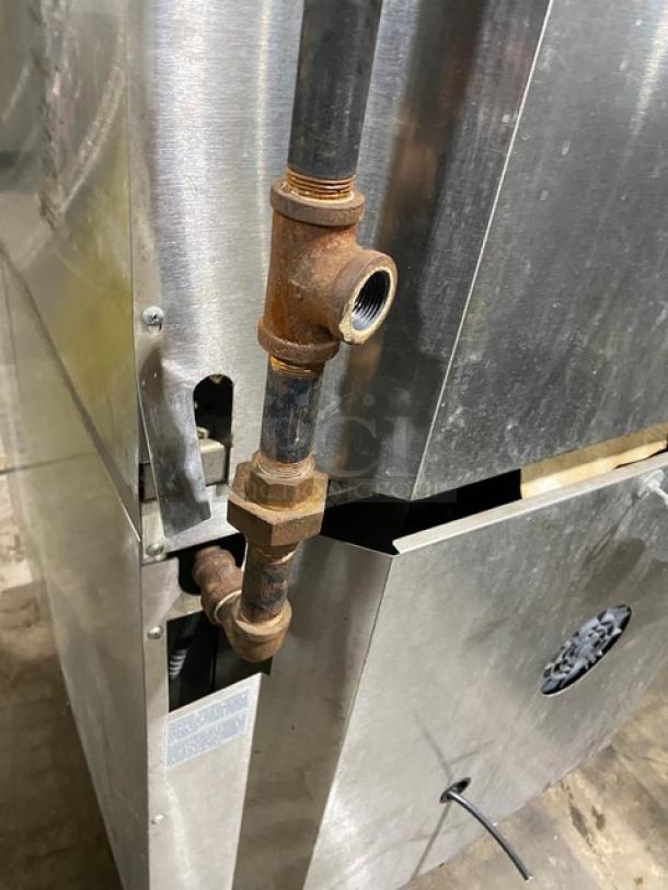 Garland Master Series double-stacked convection oven, stainless steel, natural gas, thermostatic controls, wired racks, on casters, visible piping.