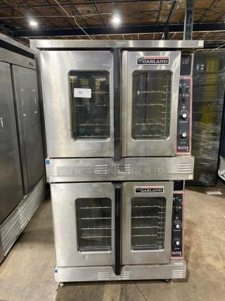 Garland Master Series stainless steel double-stacked convection oven. Features thermostatic controls and wired racks. On casters.