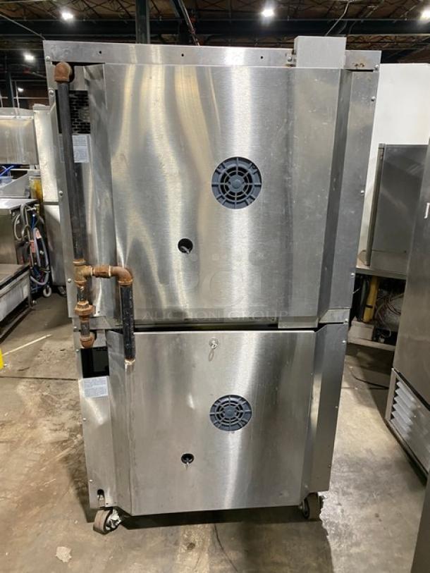 Garland Master Series double-stacked convection oven, stainless steel, natural gas, thermostatic controls, wired racks, on casters.