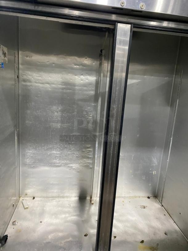 True T-49 commercial stainless steel 2-door reach-in refrigerator. Energy Star certified, on casters, interior view.