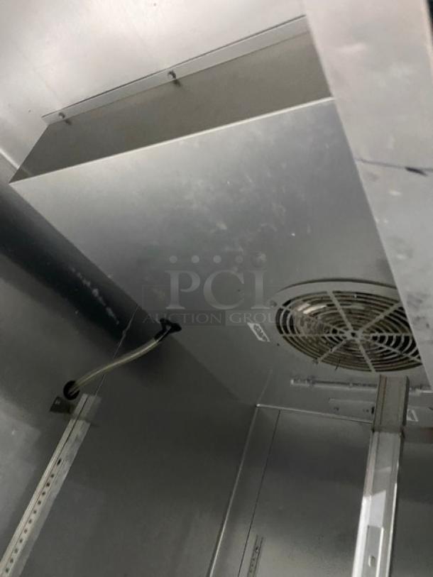 True T-49 commercial stainless steel 2-door reach-in refrigerator interior. Energy Star certified, on casters, 115V, 1 phase.