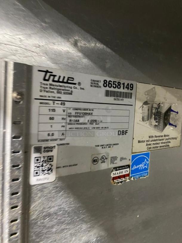 True T-49 stainless steel refrigerator, dual solid doors, Energy Star certified, model SN: 8658149, on casters, 115V, 1 phase.