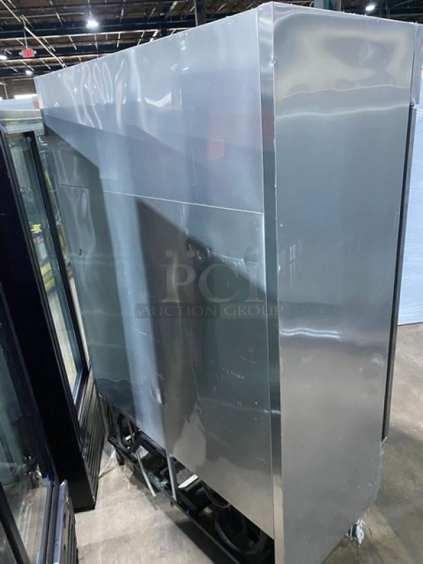 True T-49DT commercial stainless steel 2-door reach-in refrigerator/freezer with poly coated wire racks and casters.