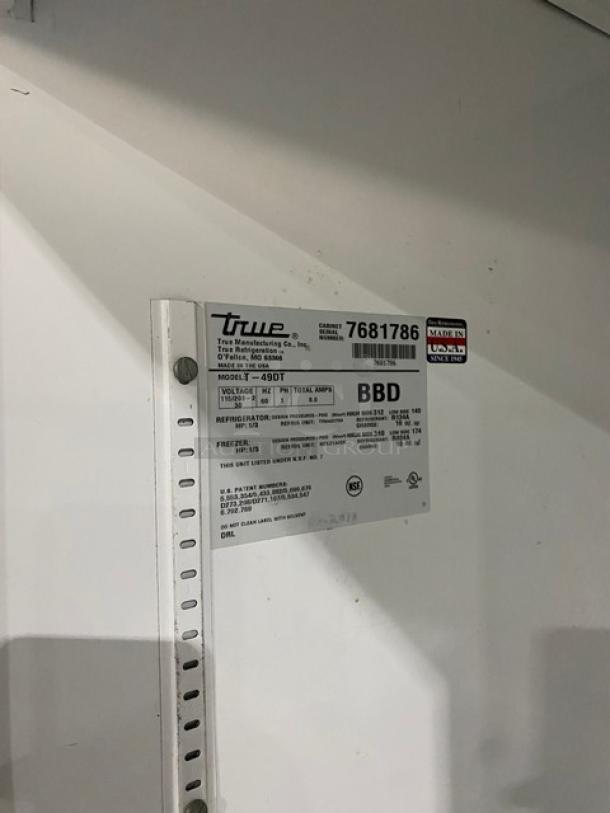 True T49DT commercial refrigerator/freezer combo, stainless steel, 2-door, poly coated wire racks, model and serial number tag visible.