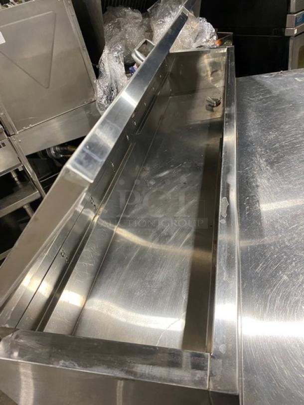 Continental CPT67SS stainless steel 2-door refrigerated pizza prep table with backsplash, poly coated wire racks, on casters.