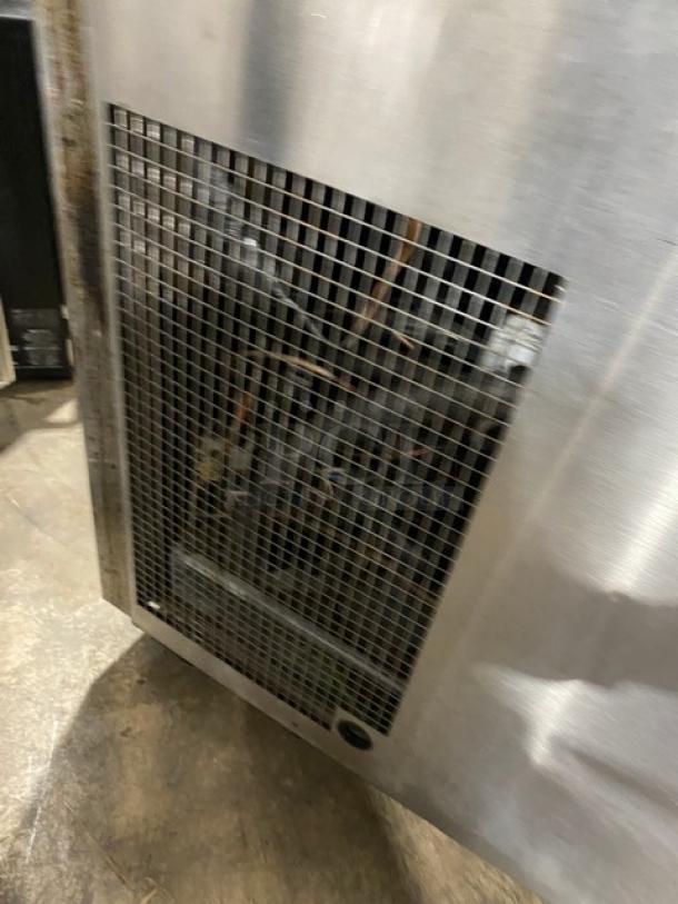 Continental CPT67SS stainless steel 2-door refrigerated pizza prep table with backsplash, poly-coated wire racks, on casters.