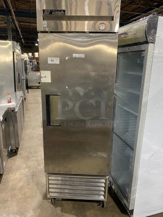 True T-23F commercial stainless steel single door reach-in freezer, solid door, poly-coated wire rack, on casters.