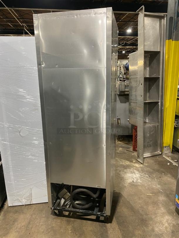 True T-23F stainless steel reach-in freezer, single door, on casters, with poly-coated wire rack, 115V, 1 Phase, SN: 1-4365518.