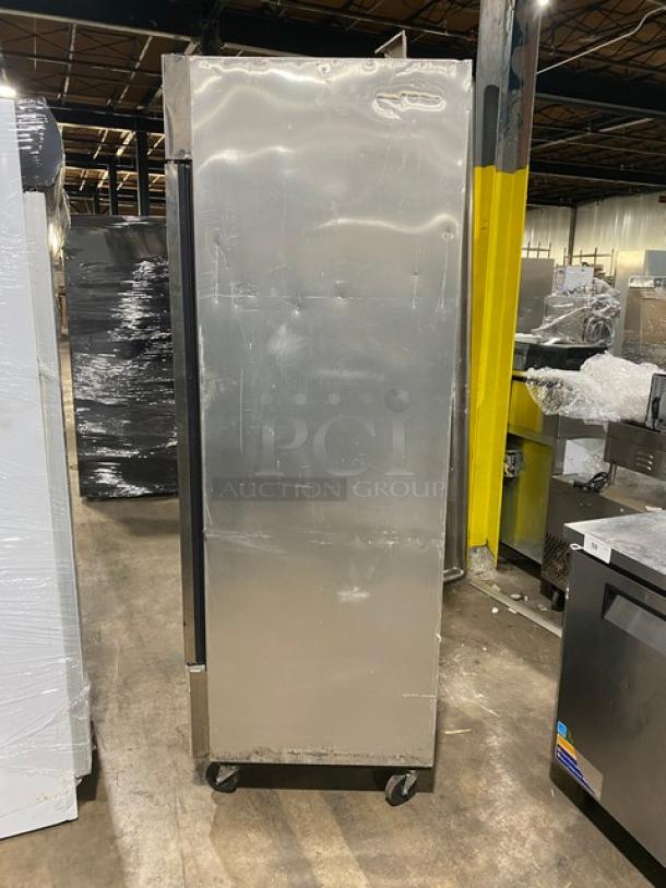 True T-23F commercial stainless steel single door reach-in freezer, model SN: 1-4365518, with poly-coated wire rack, 115V 1 phase, on casters.