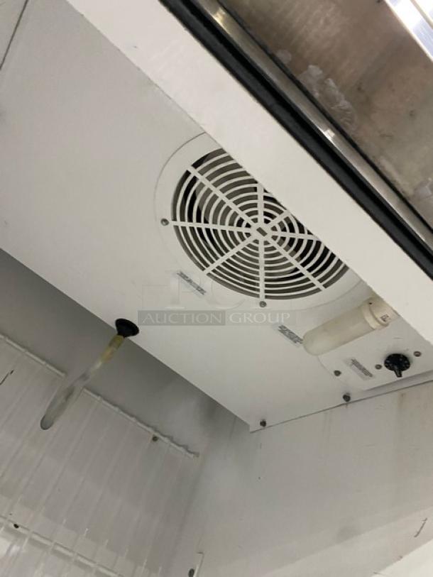 True T-23F commercial stainless steel single-door reach-in freezer interior. Features poly-coated wire rack, fan, and controls.
