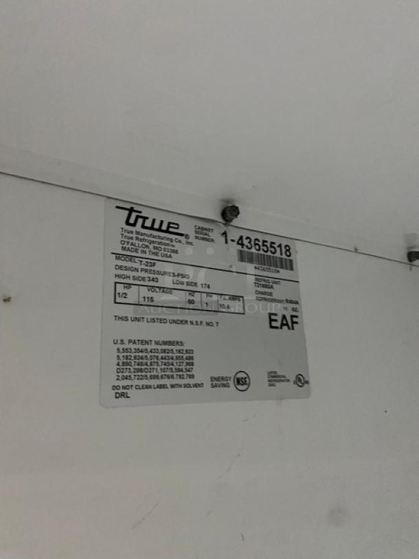 True T-23F stainless steel reach-in freezer with poly-coated wire rack, single solid door, on casters. Model T-23F, SN: 1-4365518.
