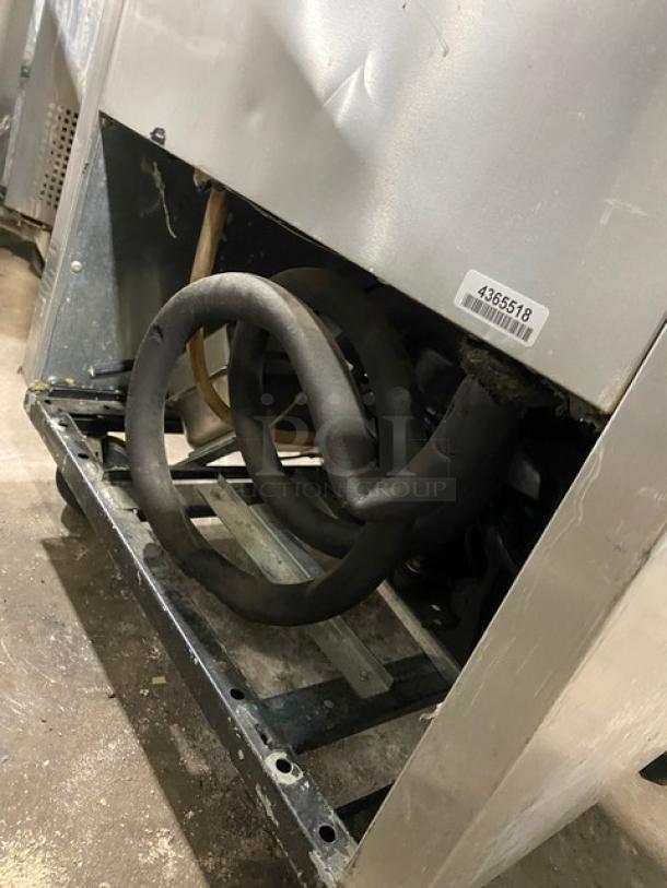 True commercial stainless steel single door reach-in freezer, model T-23F, with poly coated wired rack, on casters, SN: 1-4365518.