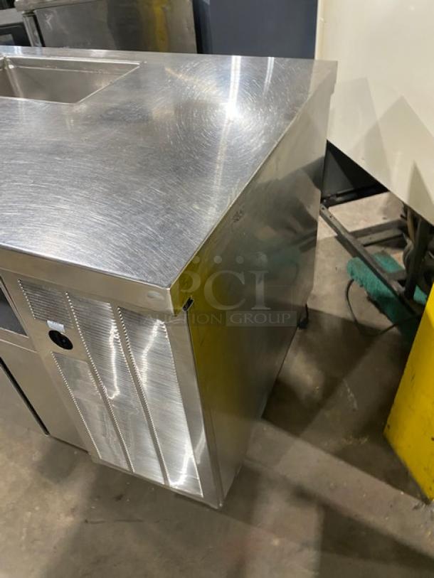 Custom stainless steel single door refrigerated salad/sandwich prep table with enclosed shelves, on casters, excellent condition.