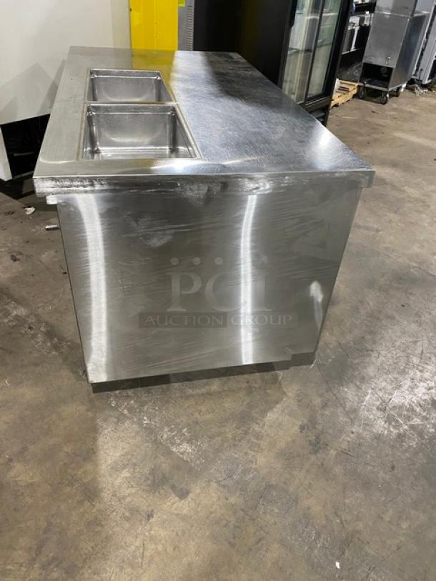 Custom stainless steel refrigerated salad/sandwich prep table with single door, enclosed shelves, and casters, in good condition.