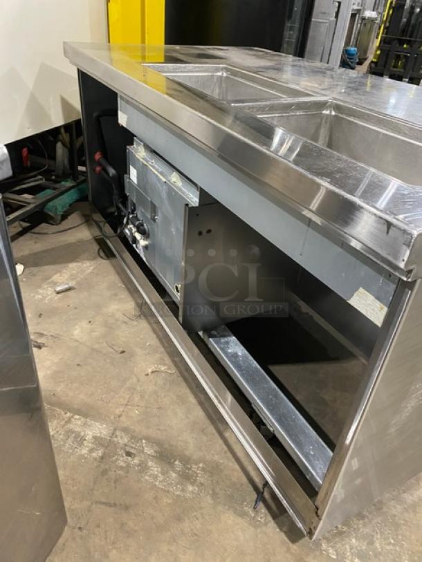 Custom stainless steel refrigerated salad/sandwich prep table with single door, enclosed storage shelves, on casters.