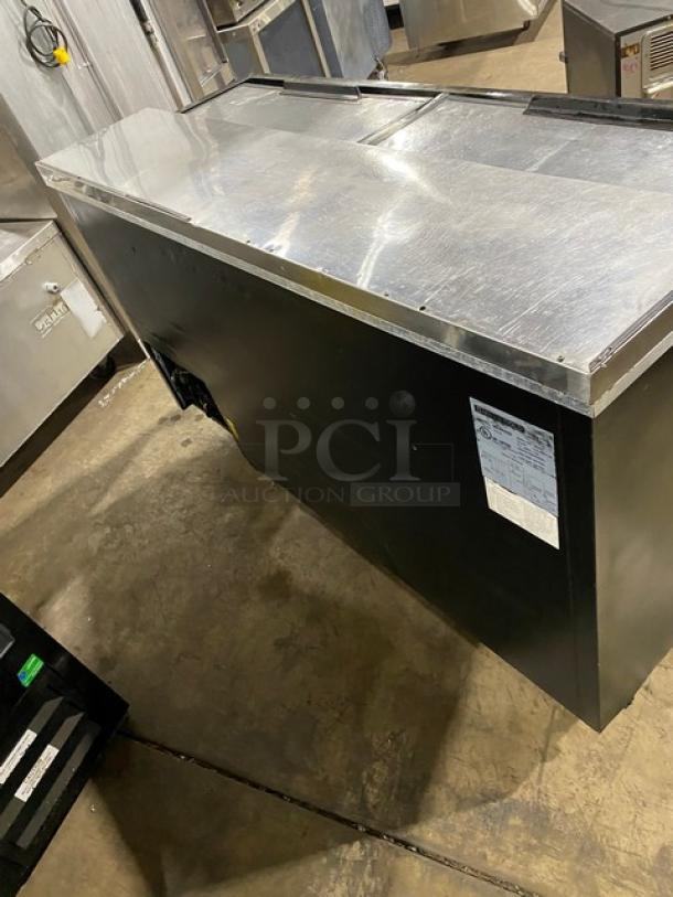 Maxx Cold MXCR65B commercial bottle cooler, black powder-coated, stainless steel top, double sliding lids, 115V, SN: 382322.