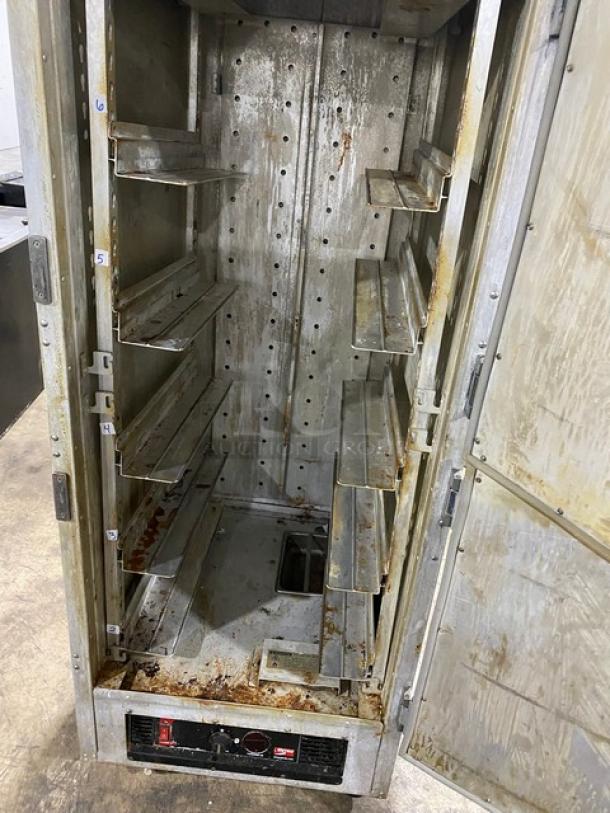 Metro Flavor Hold Series insulated heated cabinet, model C199H1N, with wide pan slides, visible wear and rust, on casters.