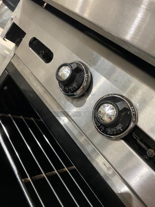 American Range commercial stainless steel flat top range/oven combo with wired oven rack. Features gas controls and casters.