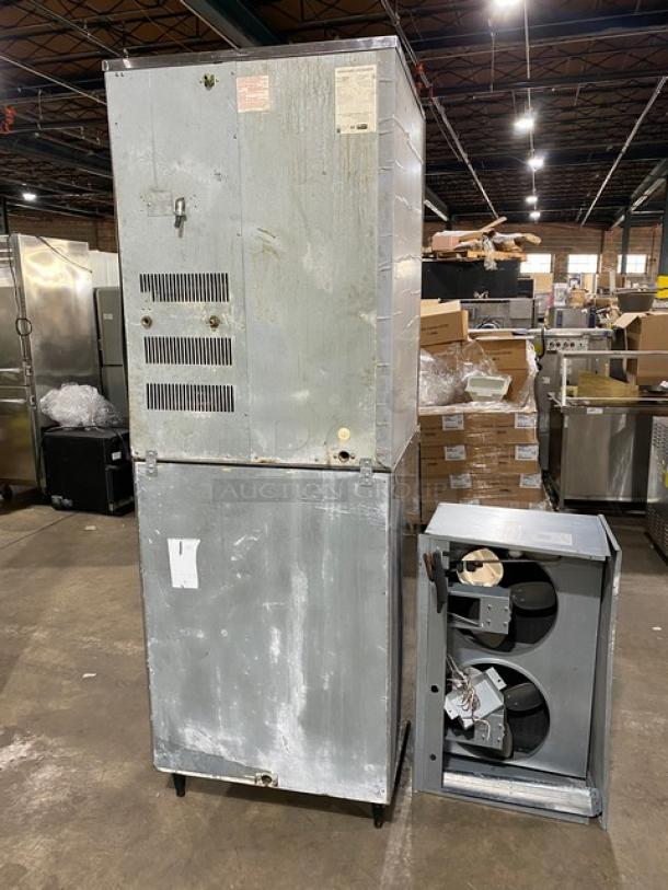 Hoshizaki KM-1340MWH commercial ice maker, stainless steel, electric water-cooled, includes top condensing unit, on legs.
