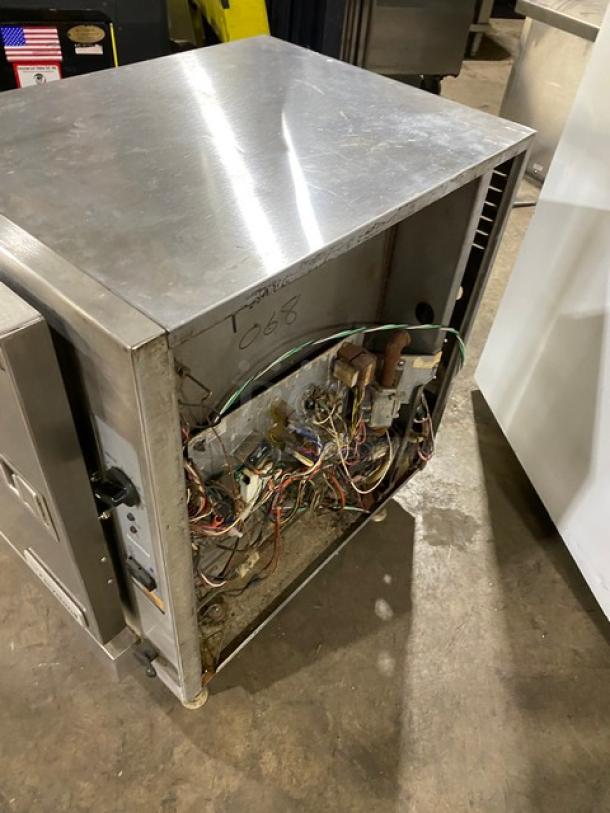 Cleveland Range SteamChef Series countertop convection steamer, model 22CGT6.1, showing internal wiring and stainless steel exterior.