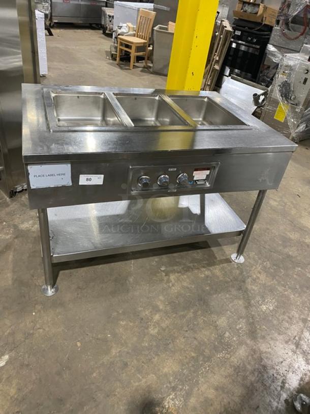 Wells Commercial Stainless Steel 3-Well Hot Food Table, Model MOD300TDM, electric, on legs, with single undershelf.