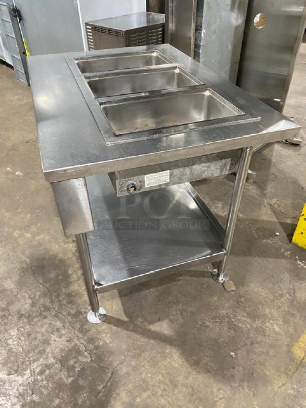 Wells MOD300TDM Stainless Steel 3-Well Hot Food Table, electric, single undershelf, on legs, 208/240V, SN: M3TD0616A0016.
