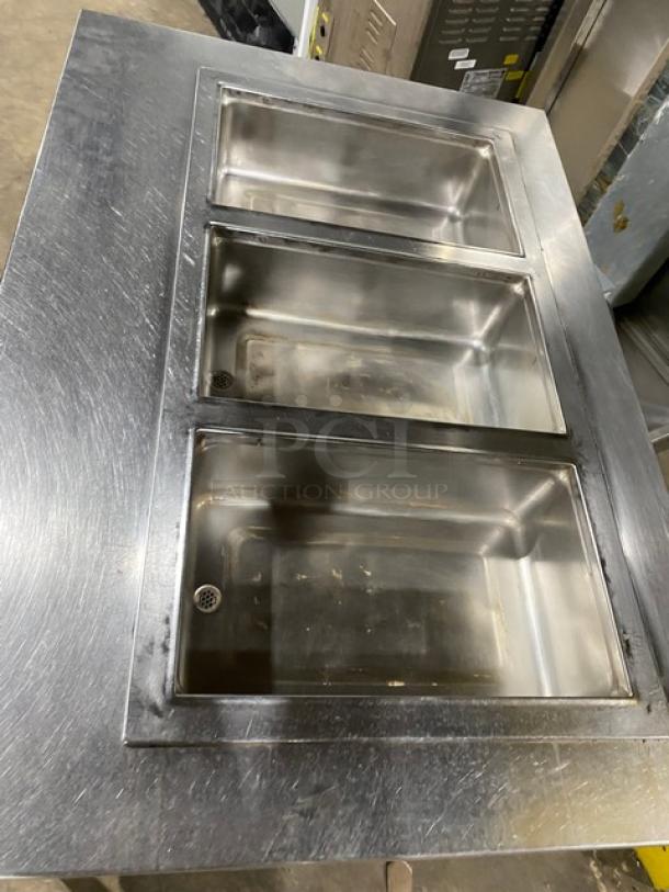Wells MOD300TDM stainless steel 3-well steam table, electric, with single undershelf, on legs, 208/240V, used condition.