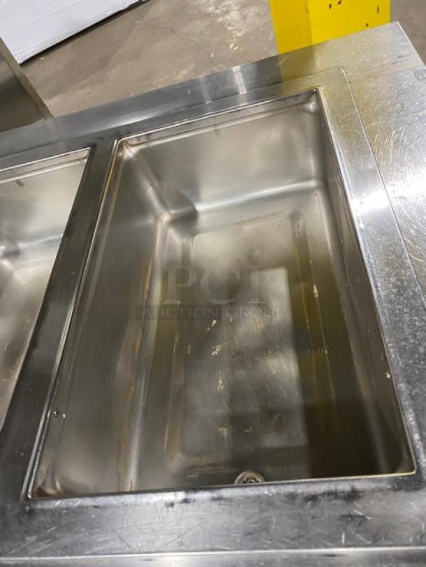 Wells MOD300TDM stainless steel 3-well hot food/steam table, electric, with single undershelf, 208/240V, on legs.