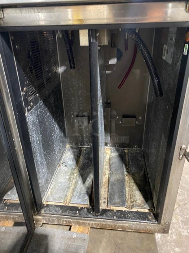 Perlick DZS36T1 stainless steel dual-zone back bar storage cabinet, open doors, interior view, commercial use, fair condition.