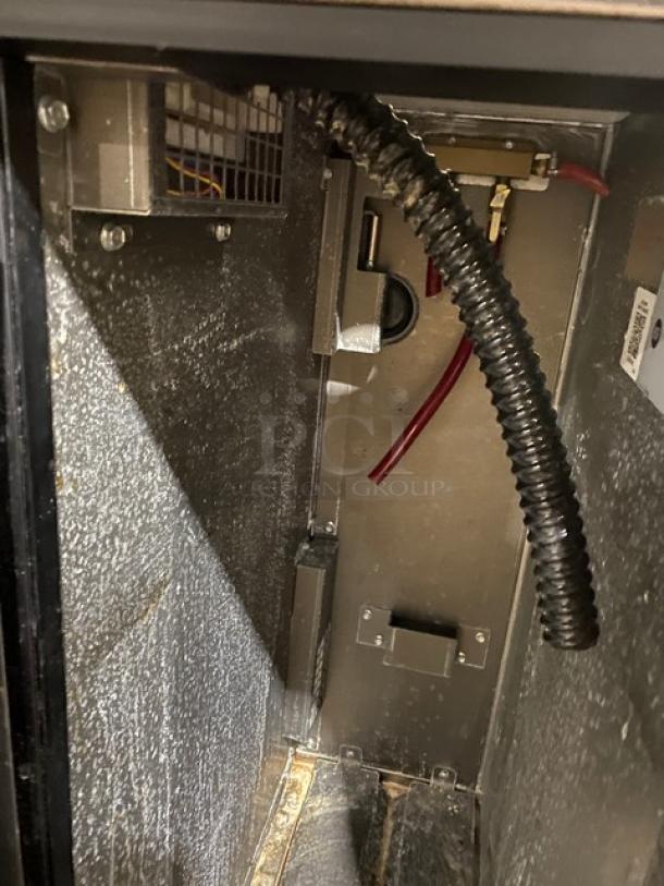 Perlick commercial stainless steel back bar storage cabinet interior, model DZS36T1, showing wiring and cooling elements.