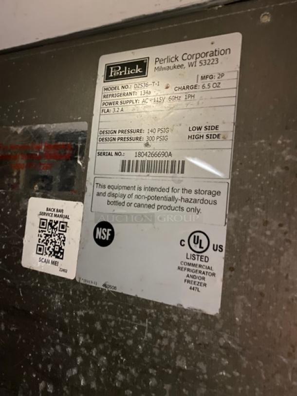 Perlick stainless steel dual-zone back bar storage cabinet, model DZS36-T-1, with labels showing model and serial number. 